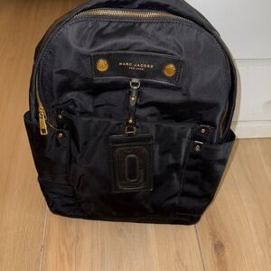 Marc Jacobs Black Backpack with Gold Hardware and Structured Design